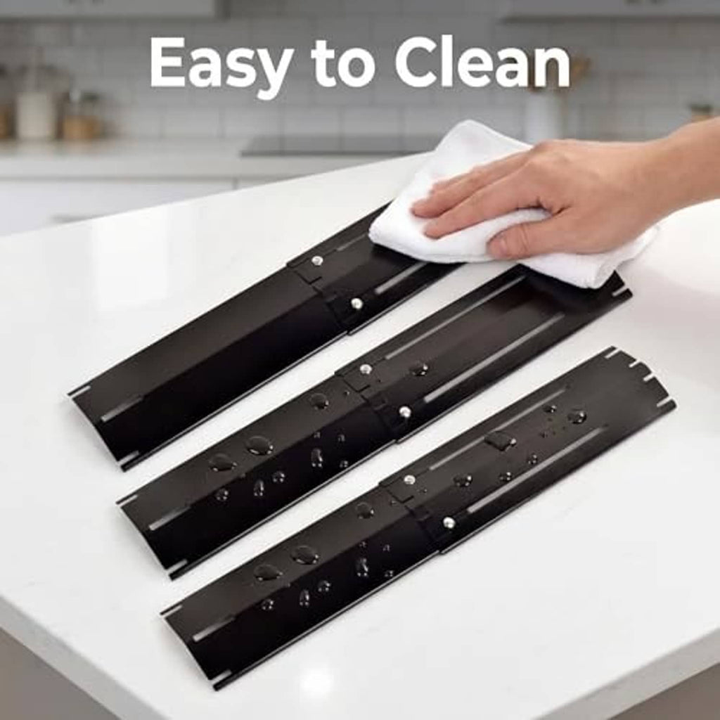 Universal grill heat shield plates on grill, dark metal with screw holes and side cutouts