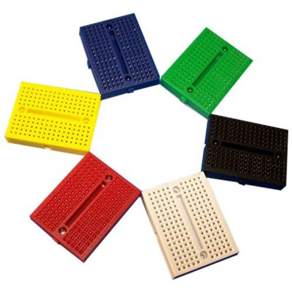 Set of mini solderless breadboards in yellow, red, green, blue, black, and white.