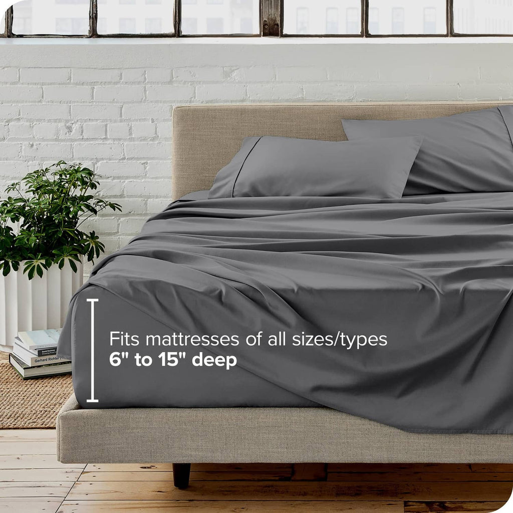 Grey split king fitted sheet on a bed: fits mattresses 6 to 15 in deep