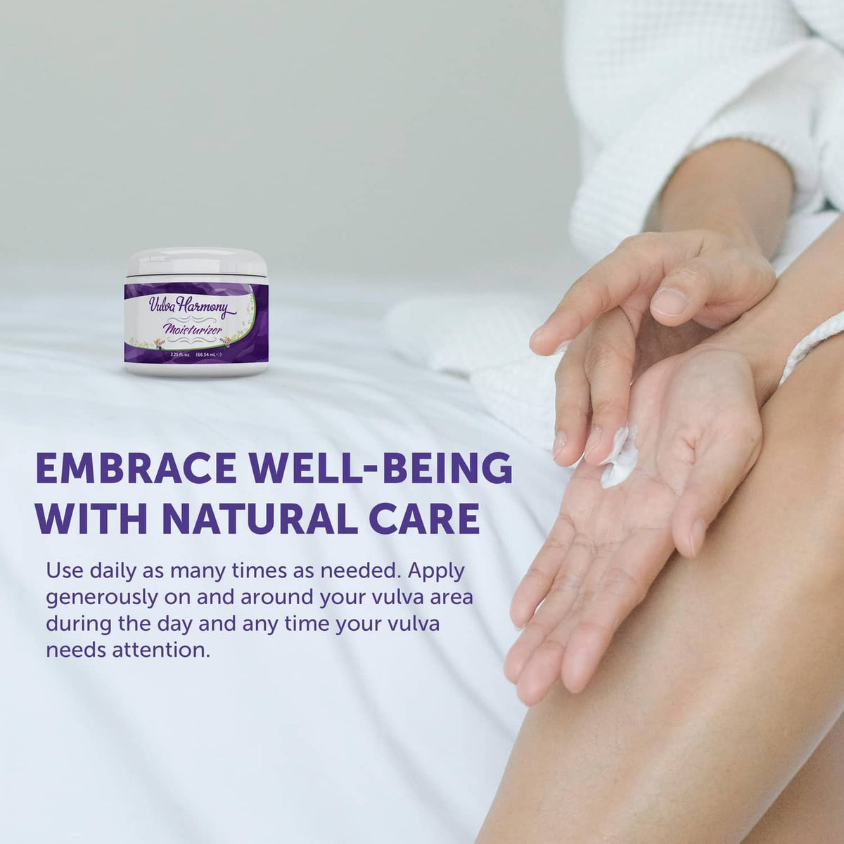 Vulva Harmony vaginal balm jar on bed with hands applying product