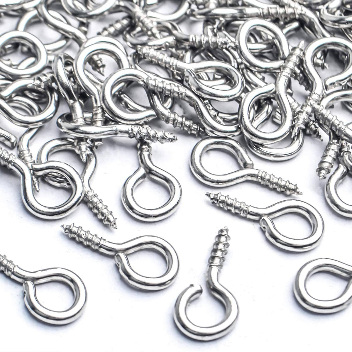 Close-up of silver-tone mini eye screw hooks with loop eyes and pointed threaded ends