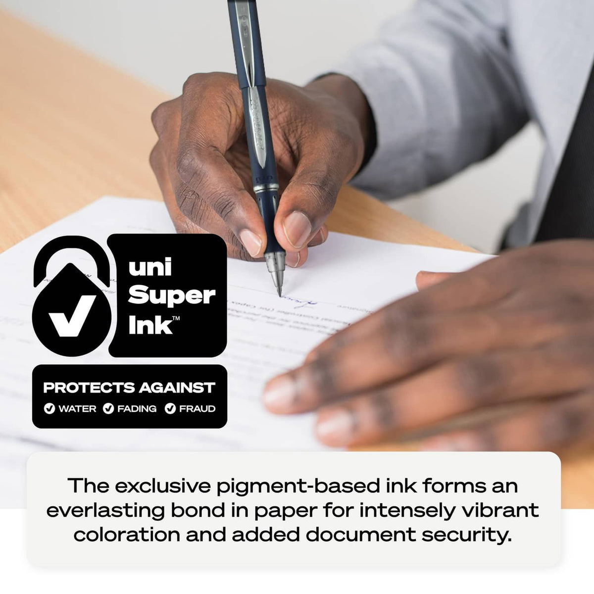 Blue ballpoint pen held over white paper for signing or notes