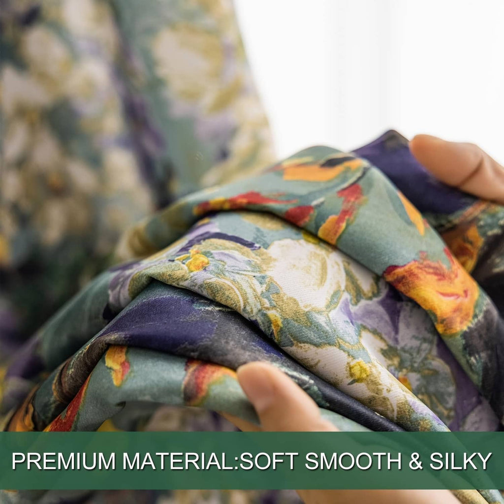 Hand touching floral green curtain fabric, smooth soft drape texture
