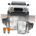 Clear rectangular turn signal lights with amber bulbs, front bumper mount