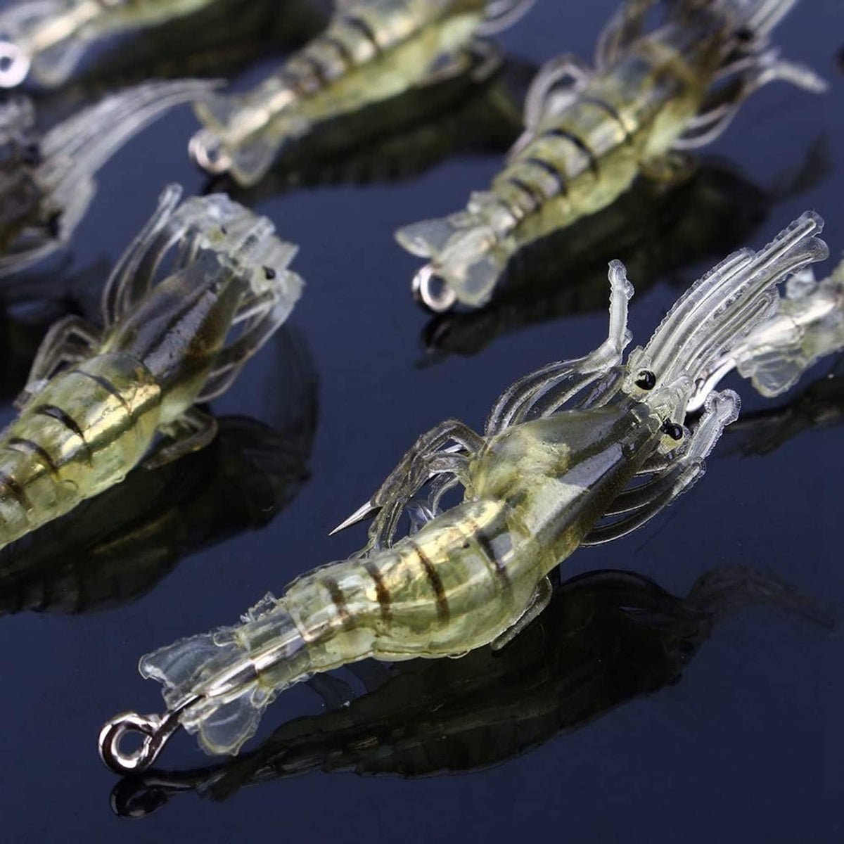 Yellow shrimp soft lure detail showing clear tail fins and silver hook