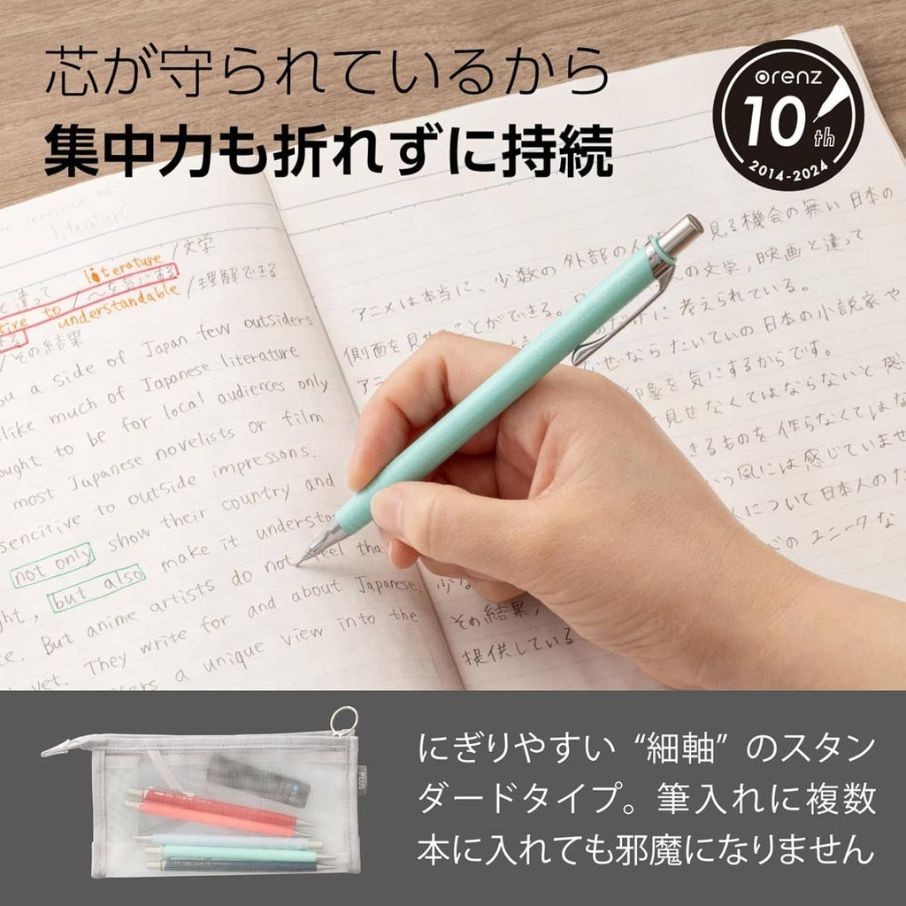 Mint mechanical pencil held while writing on paper; small refill pouch inset