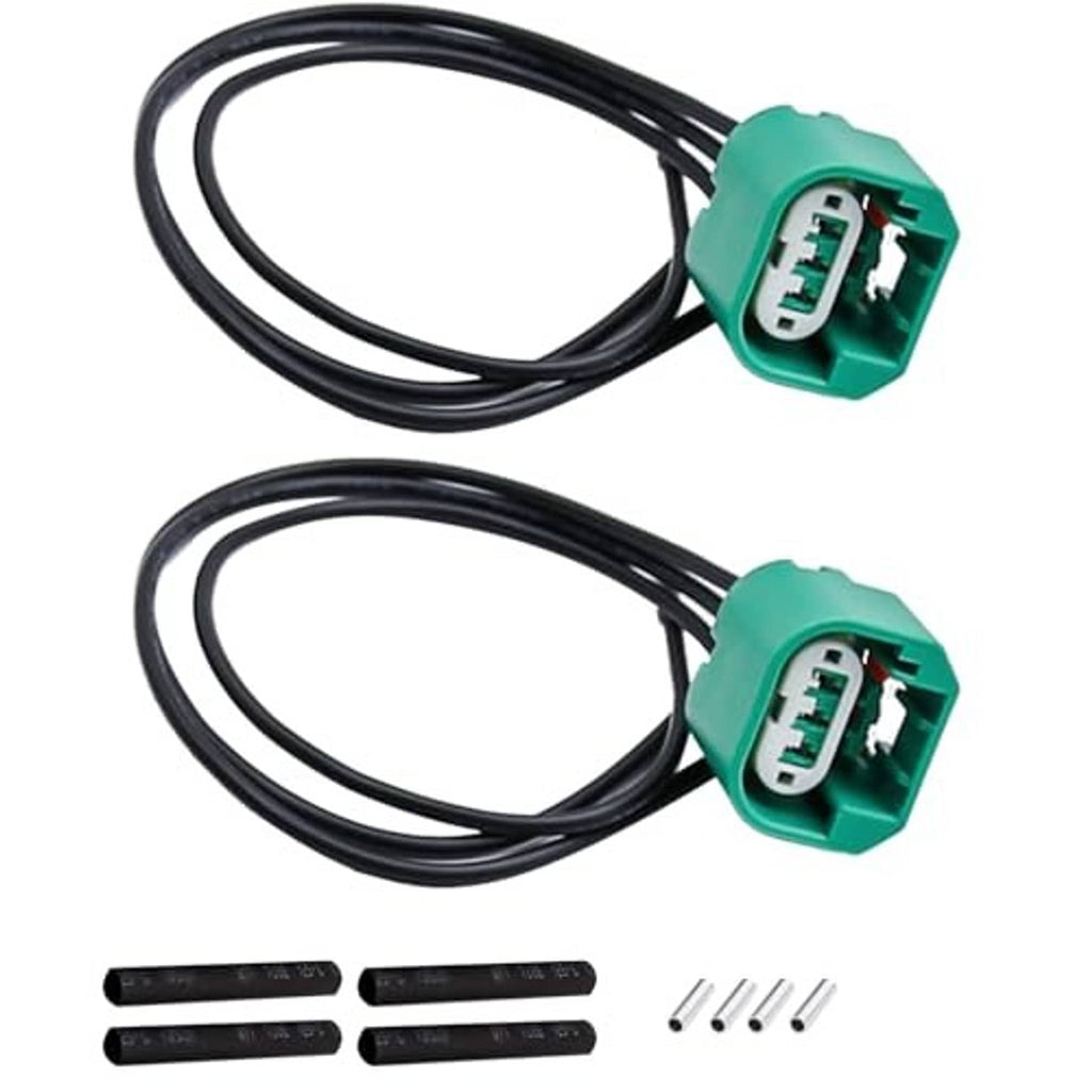 Headlight wiring connector harness with two green plugs and curved black wire leads