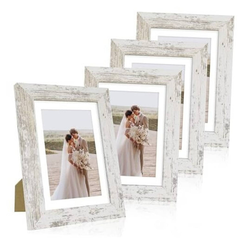 Distressed white 5x7 frames set holding a wedding portrait photo
