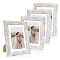 Distressed white 5x7 frames set holding a wedding portrait photo