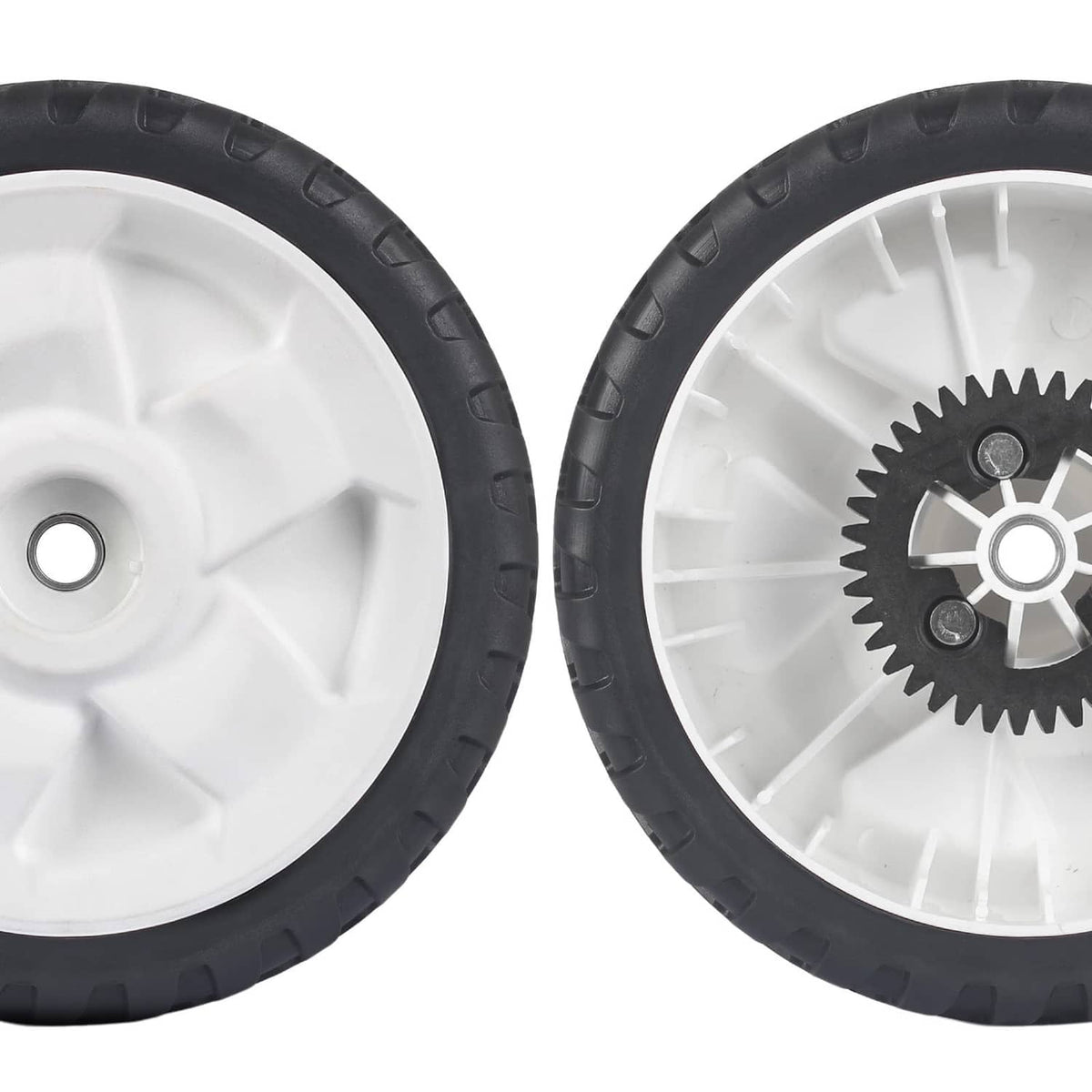 Close-up of two rear replacement wheels with black tires and white rims