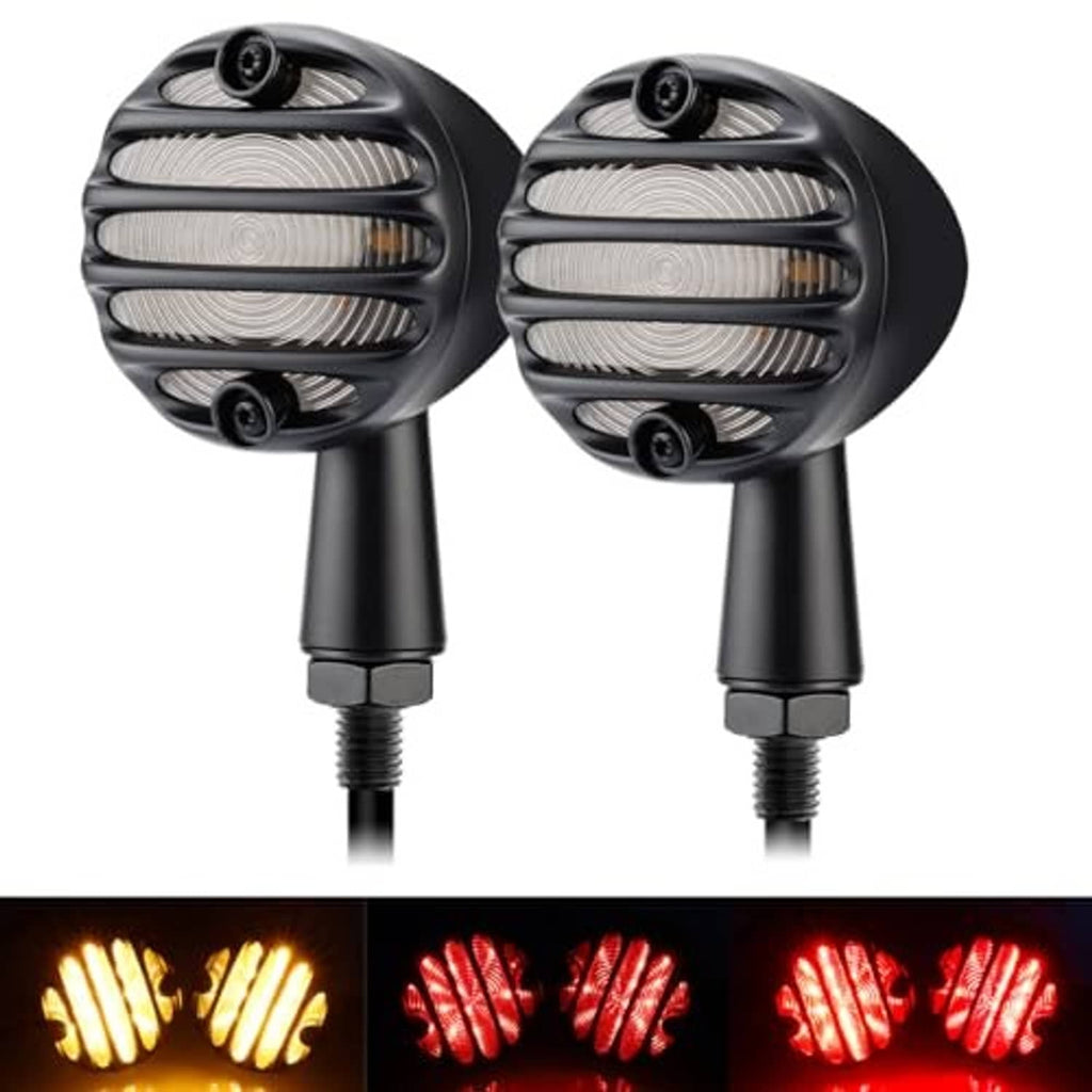 Two black LED motorcycle turn signals with illuminated amber and red modes from grille lenses
