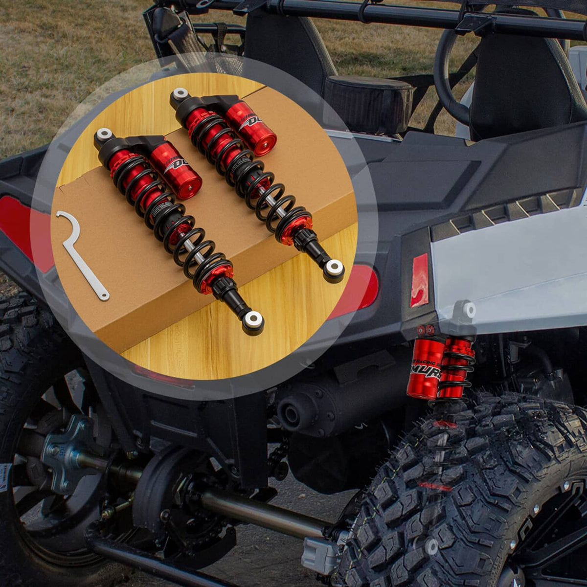 Red adjustable air shock absorbers with black mounts for off-road UTV