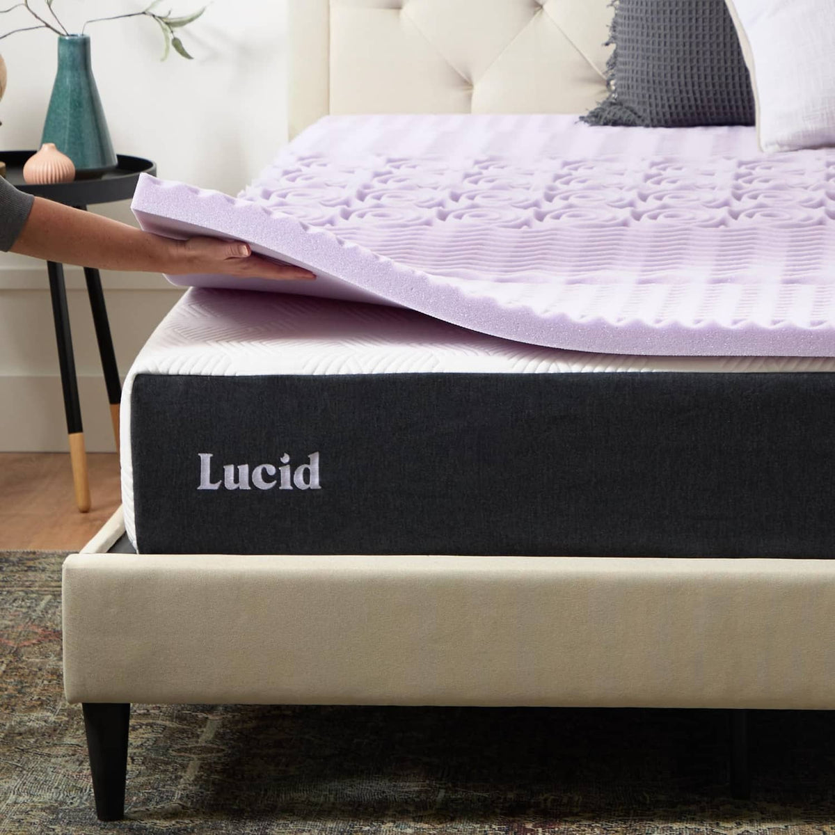 Lucid lavender memory foam mattress topper with black base and folded top