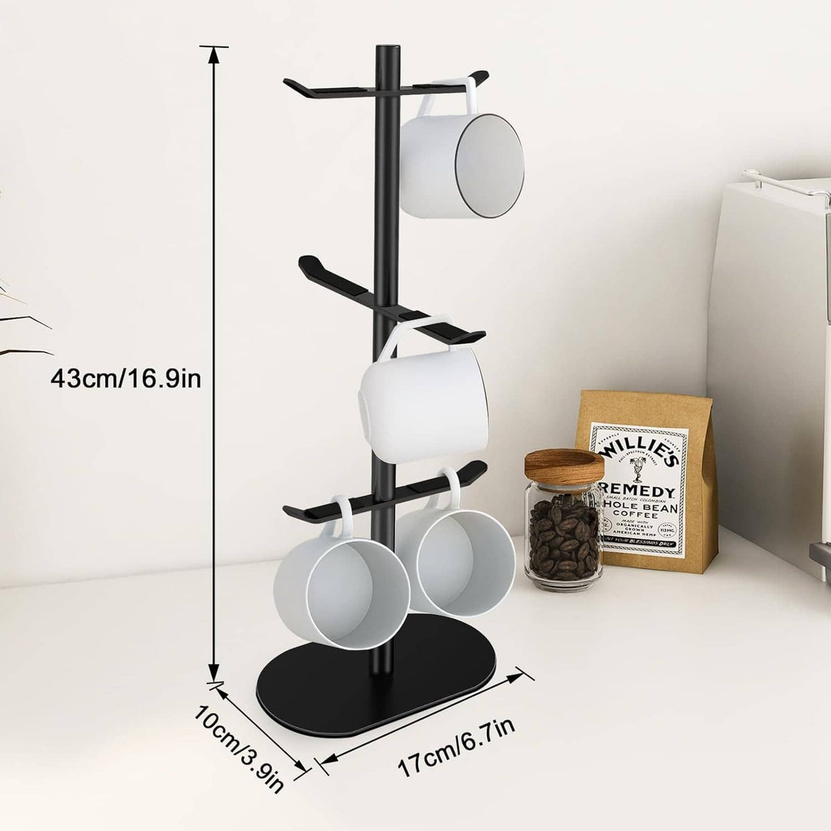 Black mug rack tree with six hooks, three rows of white and gray cups, round base