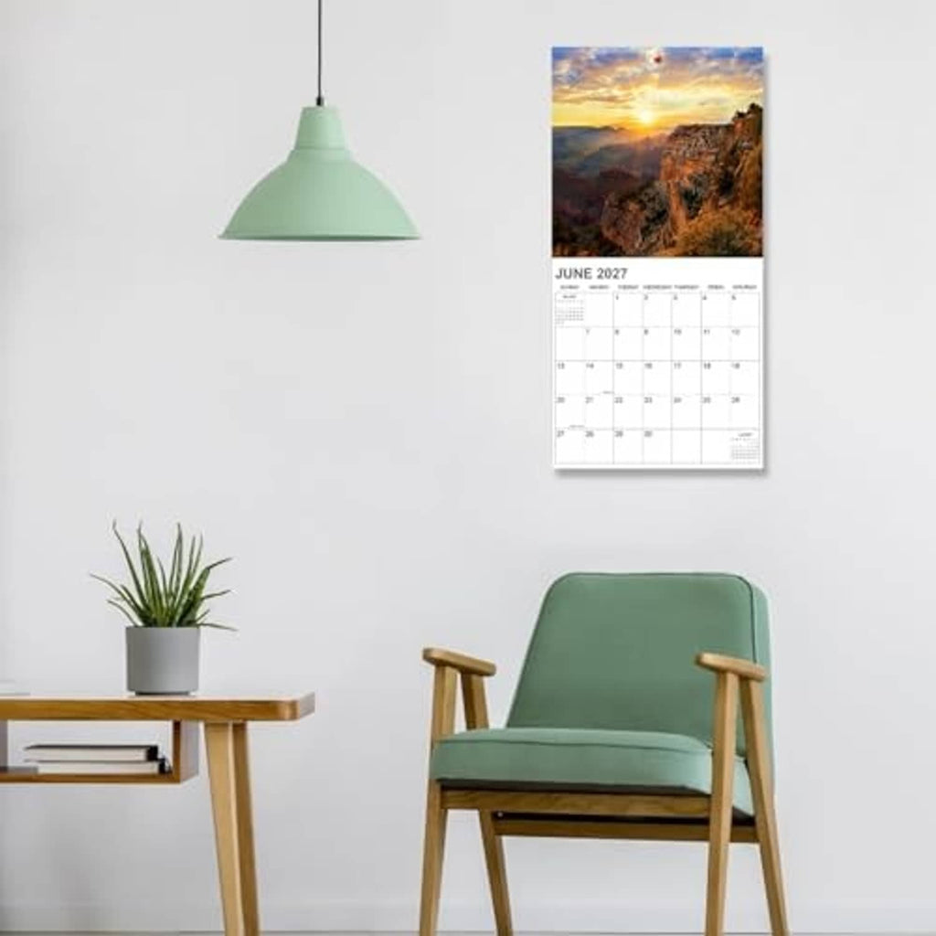 National Parks wall calendar hanging on wall, showing June 2027 with photo header.
