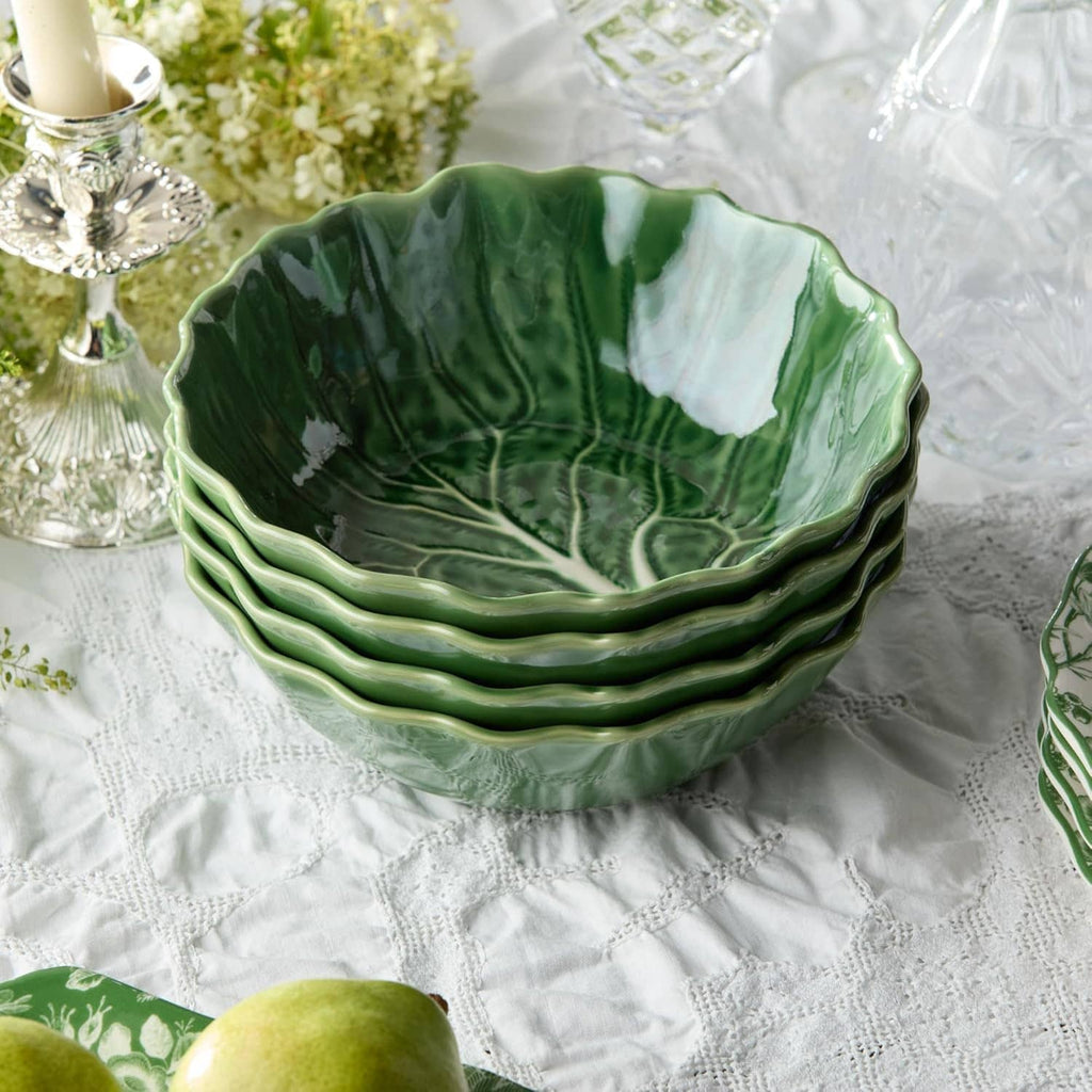 Green cabbage-relief soup bowls set of four on table, multiple bowls shown