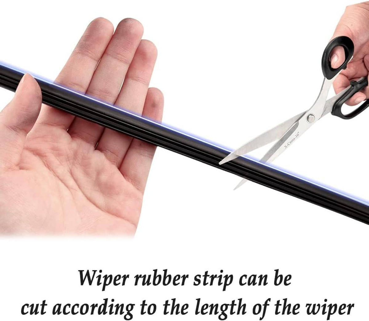 Black DIY wiper rubber strip in hand with scissors cutting along the blade edge