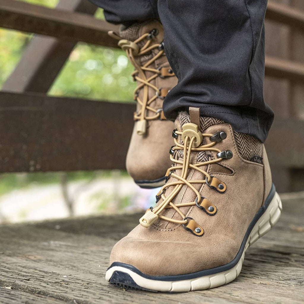 Tan boot with elastic no-tie laces, metal eyelets, and beige lock toggle