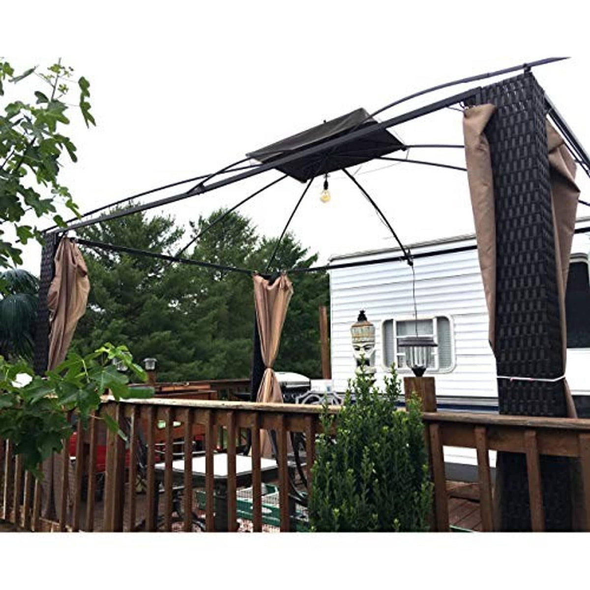 Black gazebo canopy top cover installed on arched frame with side panels open