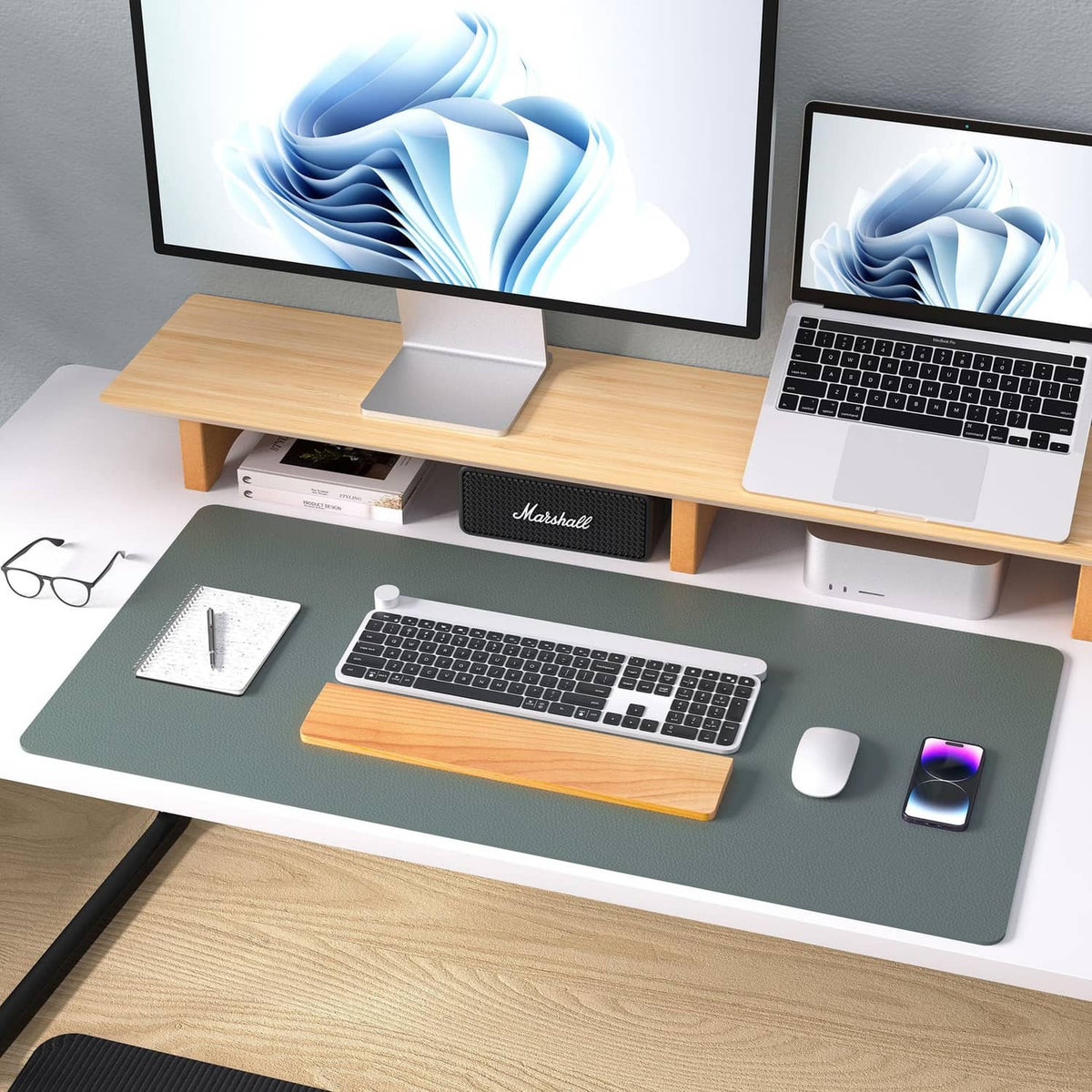 Jungle green leather desk pad protector on desk with keyboard, mouse, and monitor