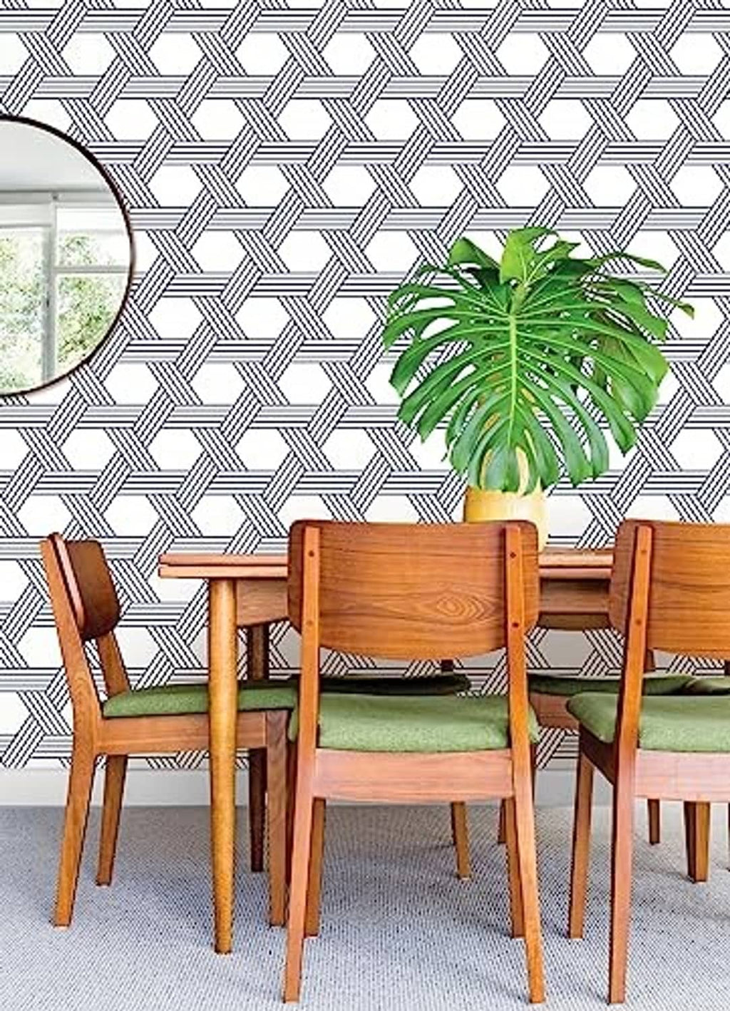Blue-and-white geometric lattice wallpaper on a wall.