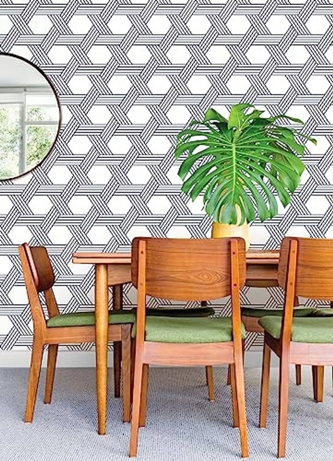 Blue-and-white geometric lattice wallpaper on a wall.