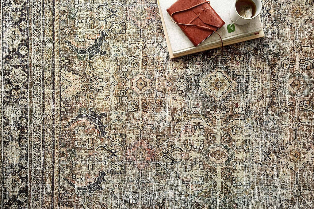 Olive and charcoal area rug with ornate distressed medallion pattern, short pile