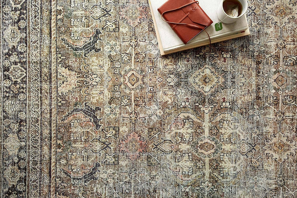 Olive and charcoal area rug with ornate distressed medallion pattern, short pile
