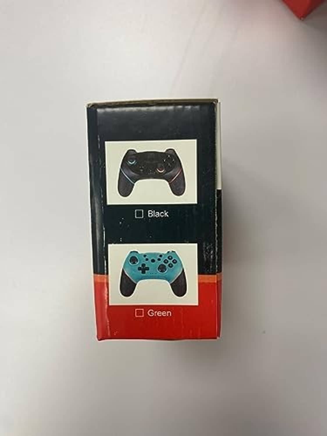Wireless game controller retail box showing black and green controllers