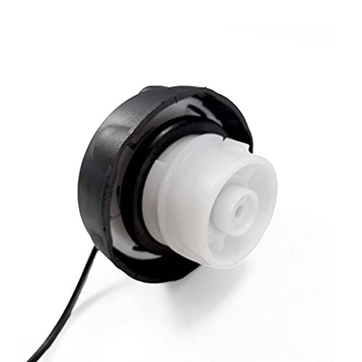 Fuel cap underside with white plastic insert and black housing
