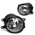 Pair of front bumper fog lights with clear lenses, chrome reflectors, and black housings