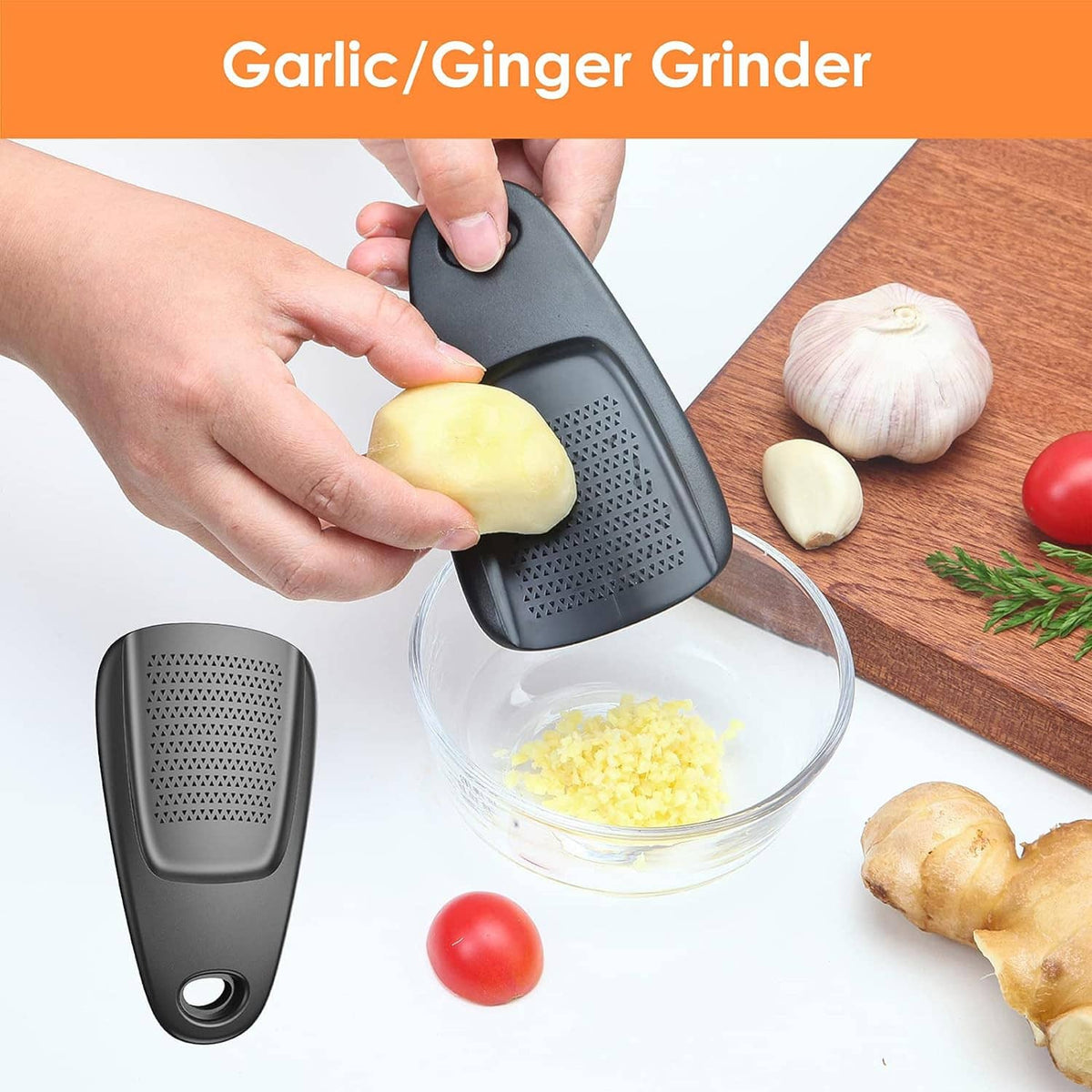 Black garlic/ginger grinder with perforated surface; held over a bowl of grated food