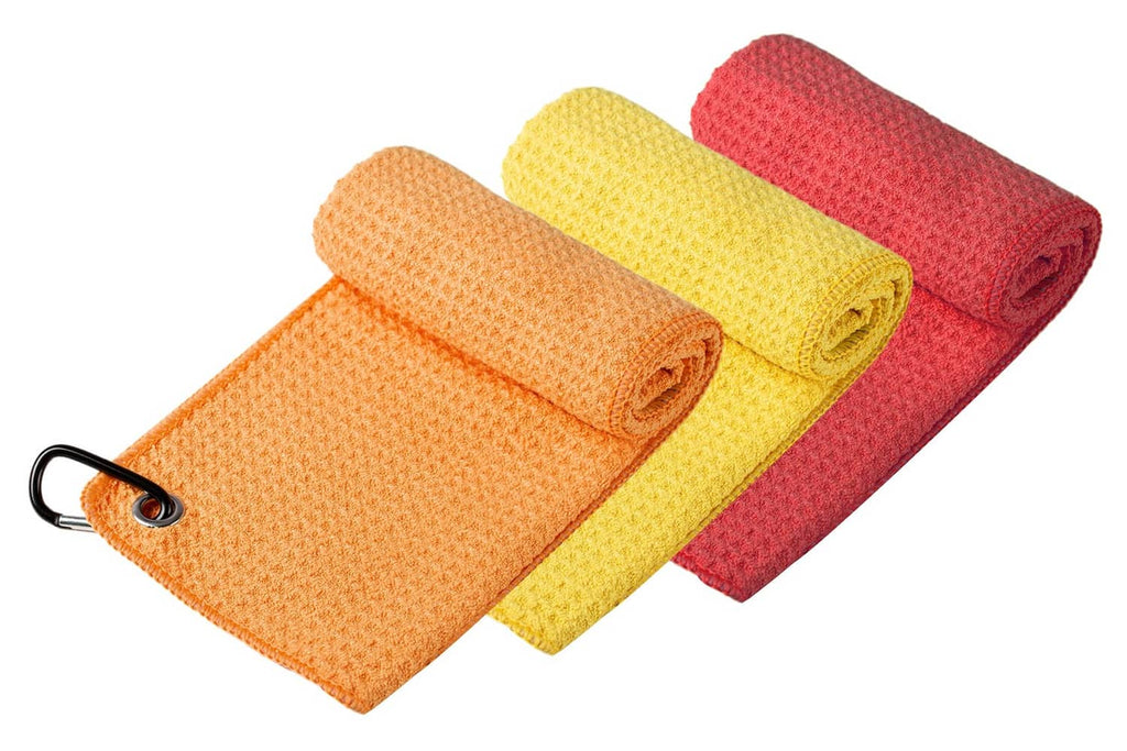 Rolled microfiber golf towels in orange, yellow, and red with black hanging loop