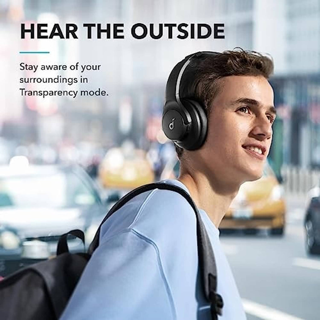 Black over-ear headphones worn by person, side profile