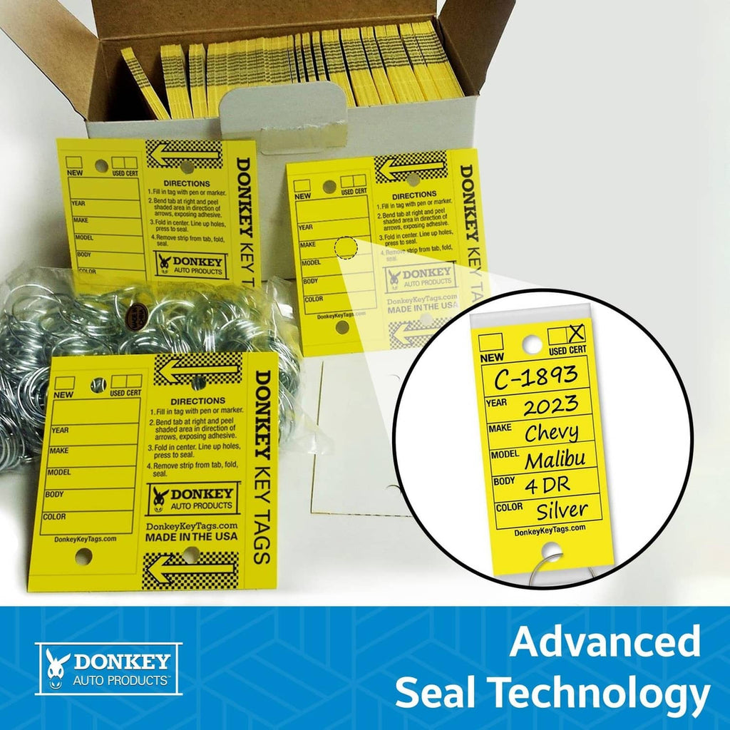 Assorted boxed laminated key tags with metal rings; seal technology label in detail