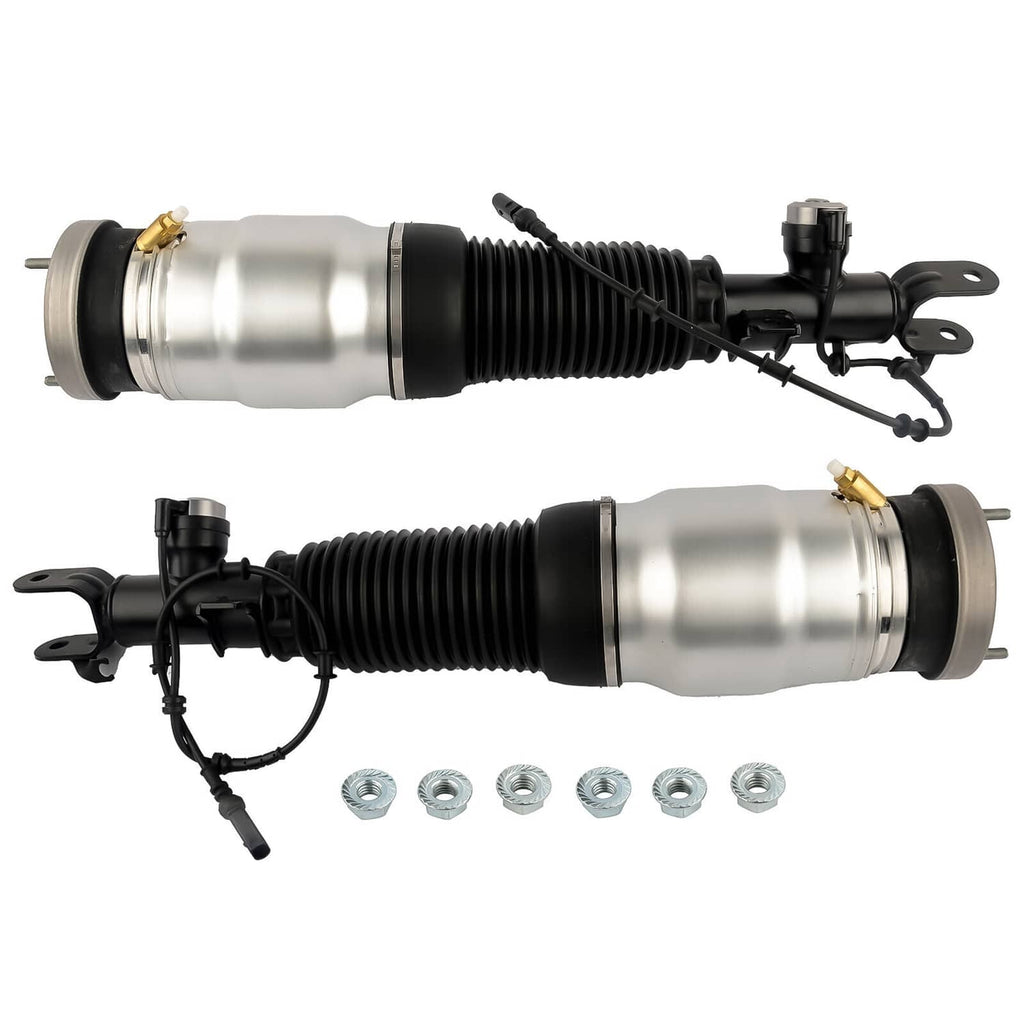 Two air suspension shock struts side by side with black boots, silver cylinders, and included nuts