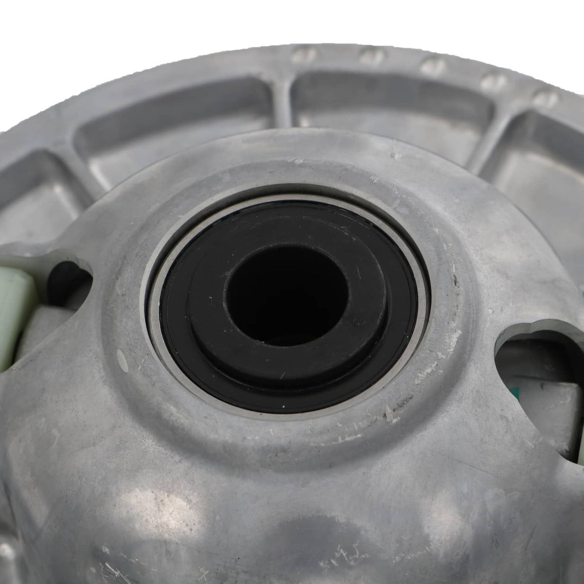 Secondary driven clutch center opening with black bushing and surrounding silver housing