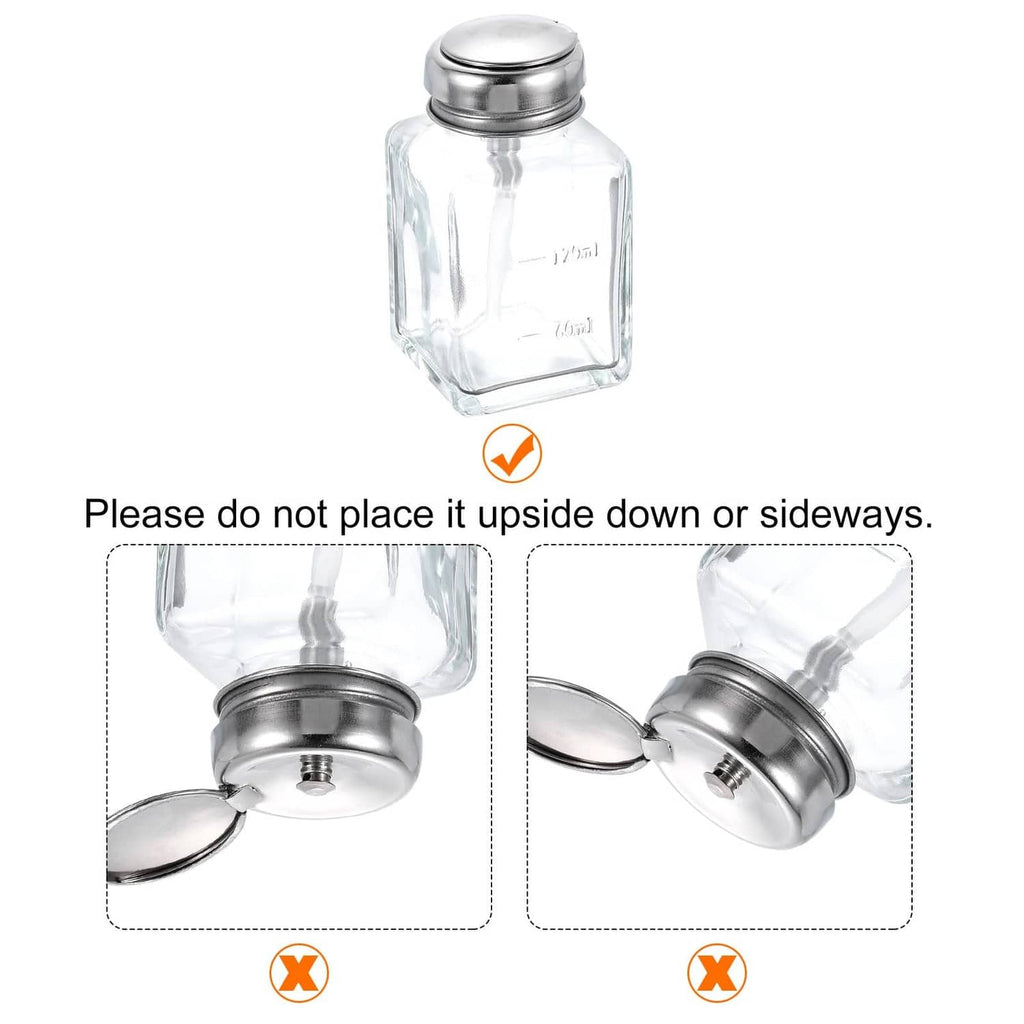 Clear glass solvent dispenser bottle with metal cap and push-down top