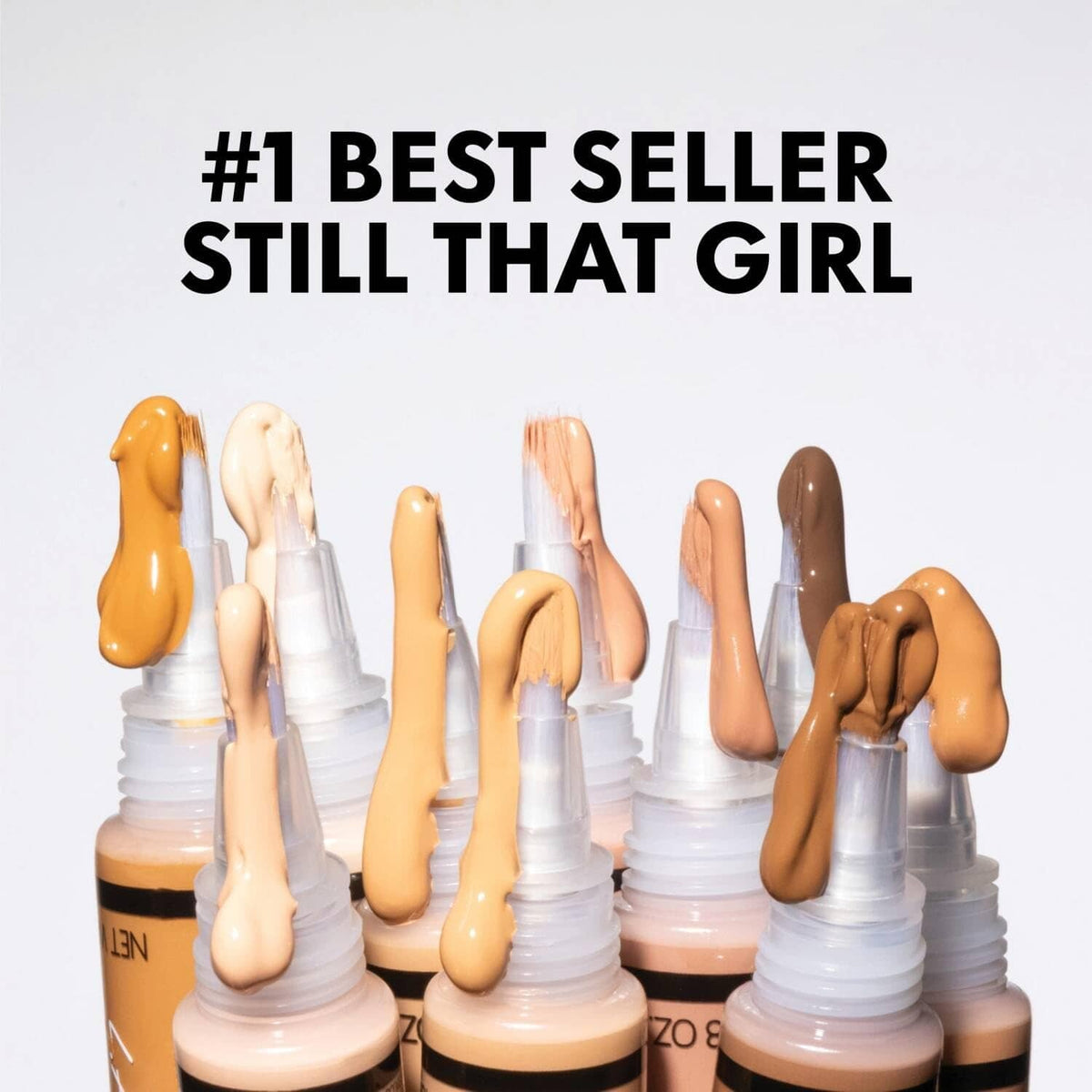 Multiple concealer shades on applicator tips with dispenser bottles