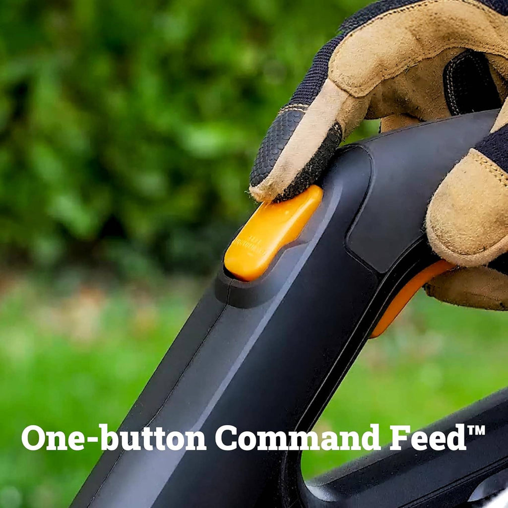 Cordless string trimmer close-up of orange one-button command feed on handle