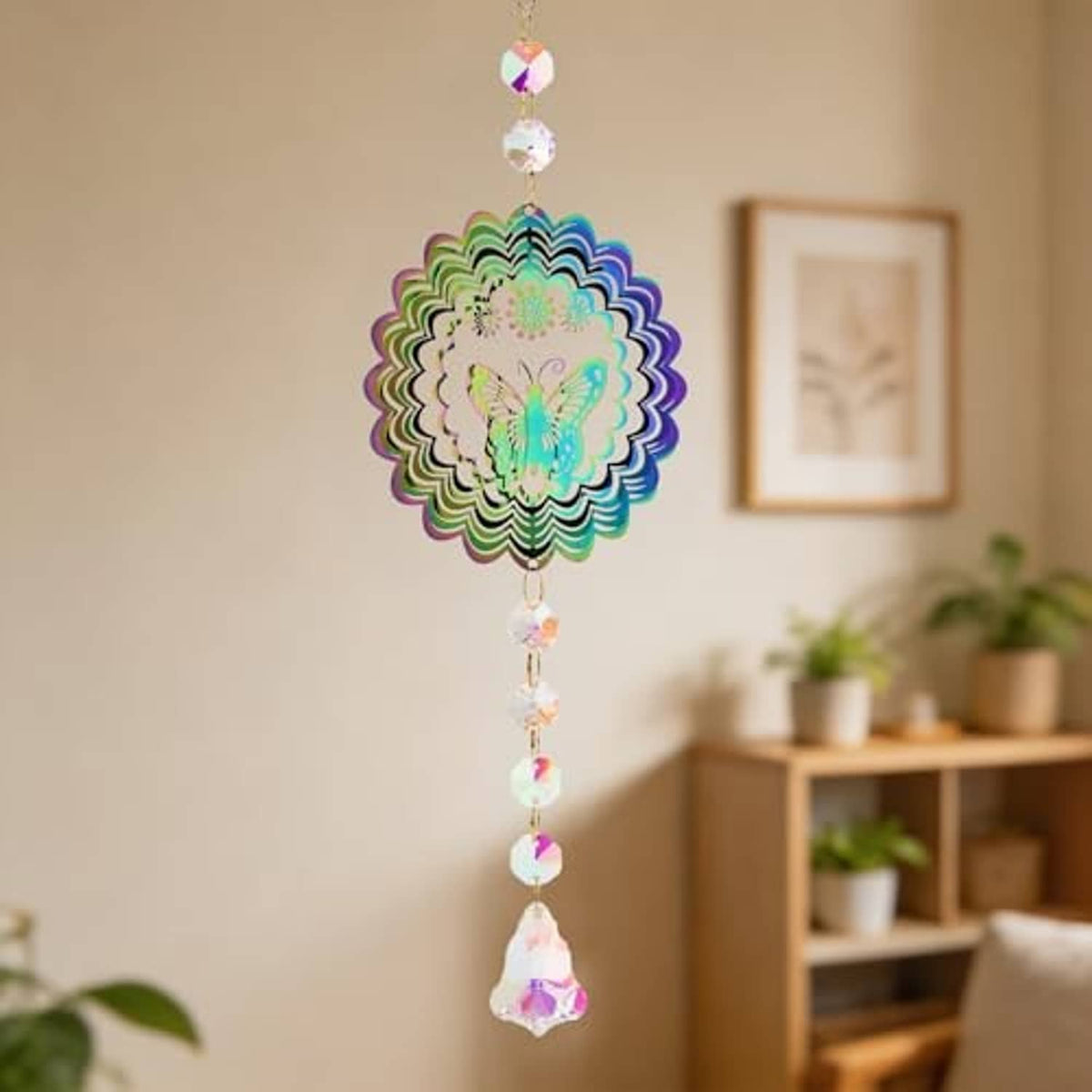 Butterfly suncatcher wind spinner with iridescent crystal disc and multicolor bead chain indoors