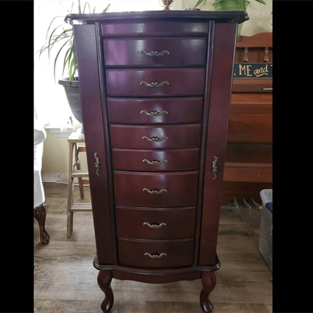 Mini cabinet front with antique-brass drawer pulls, ornate curved handle design