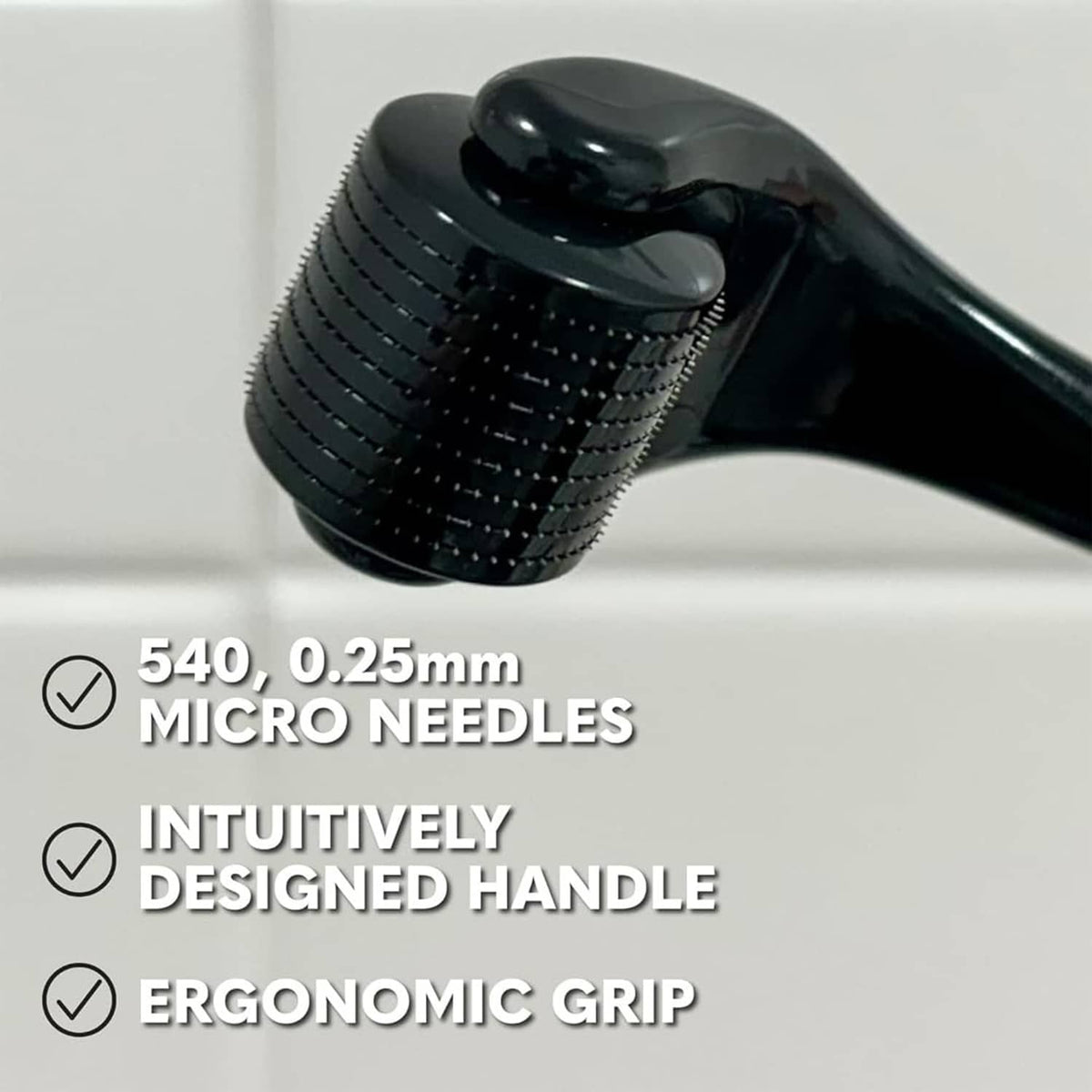 Close-up of black derma roller head with micro-needle texture on handle