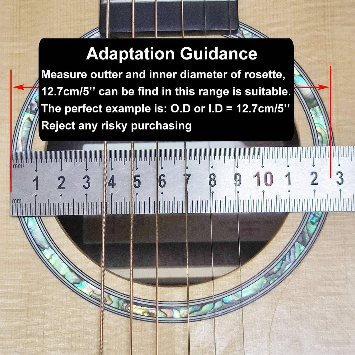 Guitar pick guard measurement with calipers over an abalone-style floral rosette