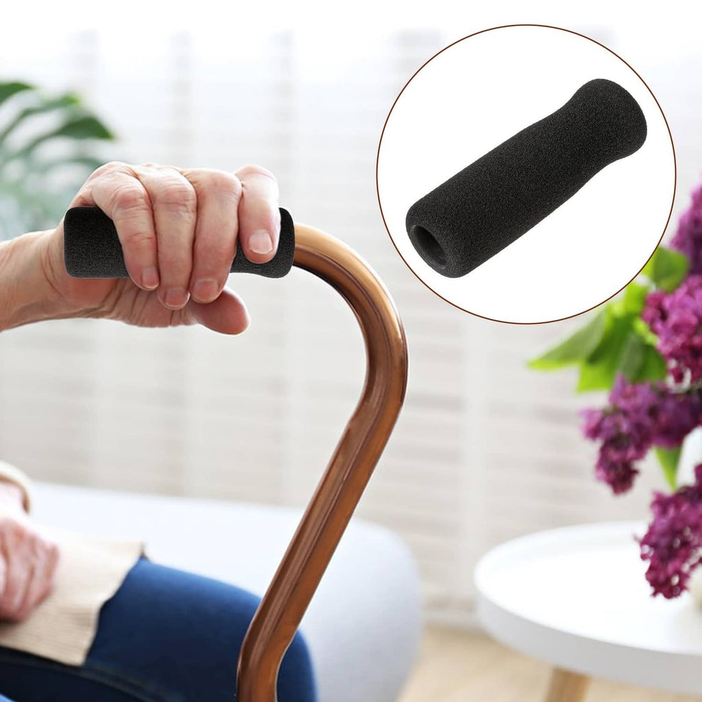 Black foam offset cane handle grip with textured surface, held by hand