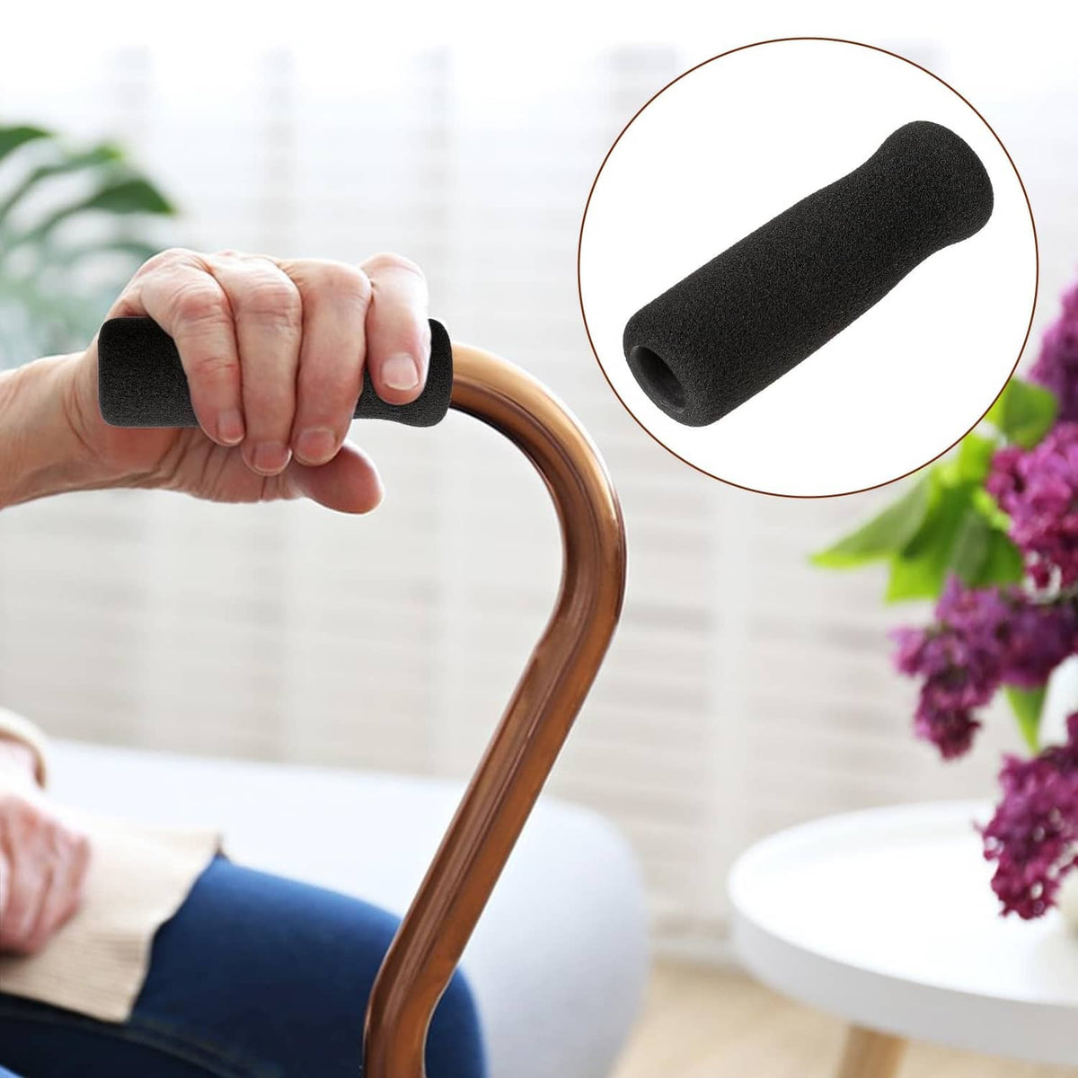 Black foam offset cane handle grip with textured surface, held by hand