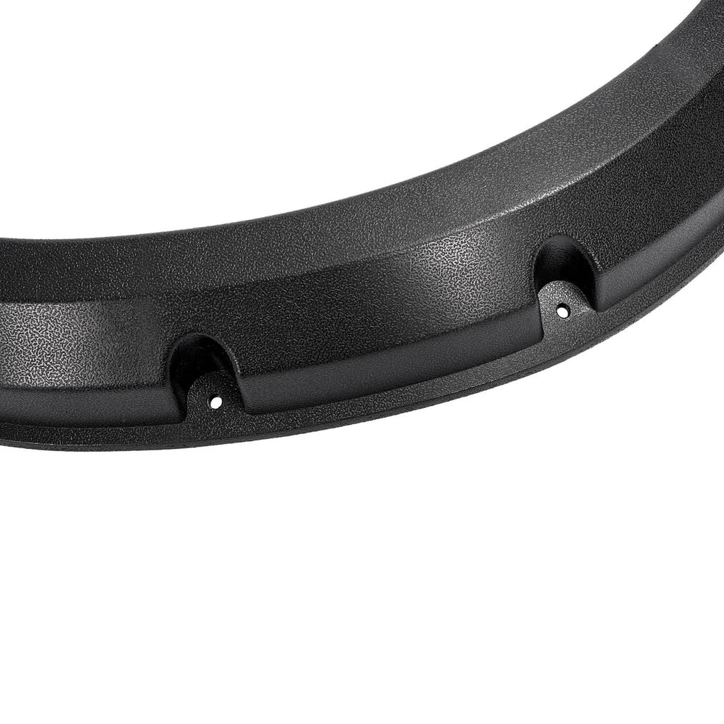 Close-up of black fender flare surface texture and mounting tab with hole