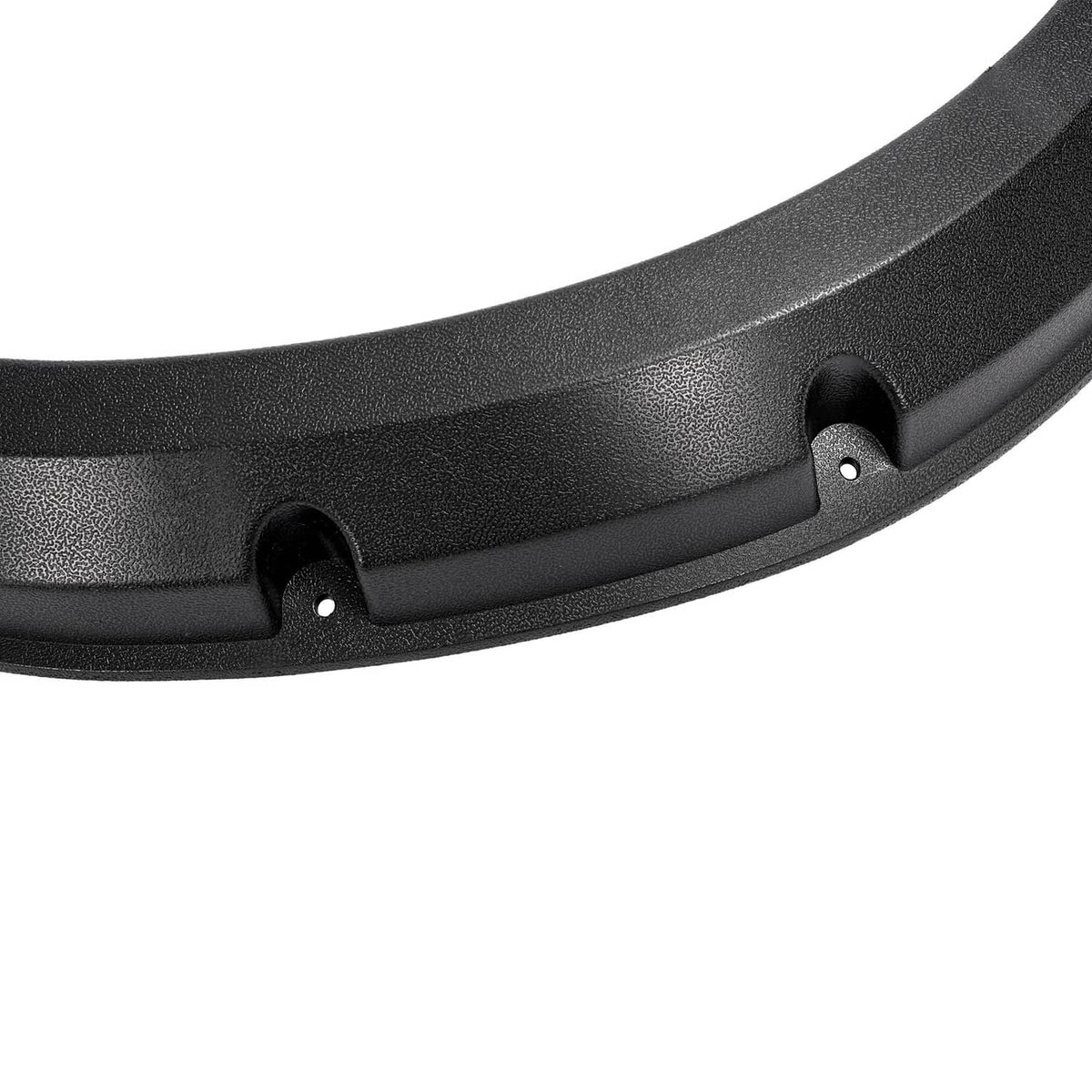 Close-up of black fender flare surface texture and mounting tab with hole