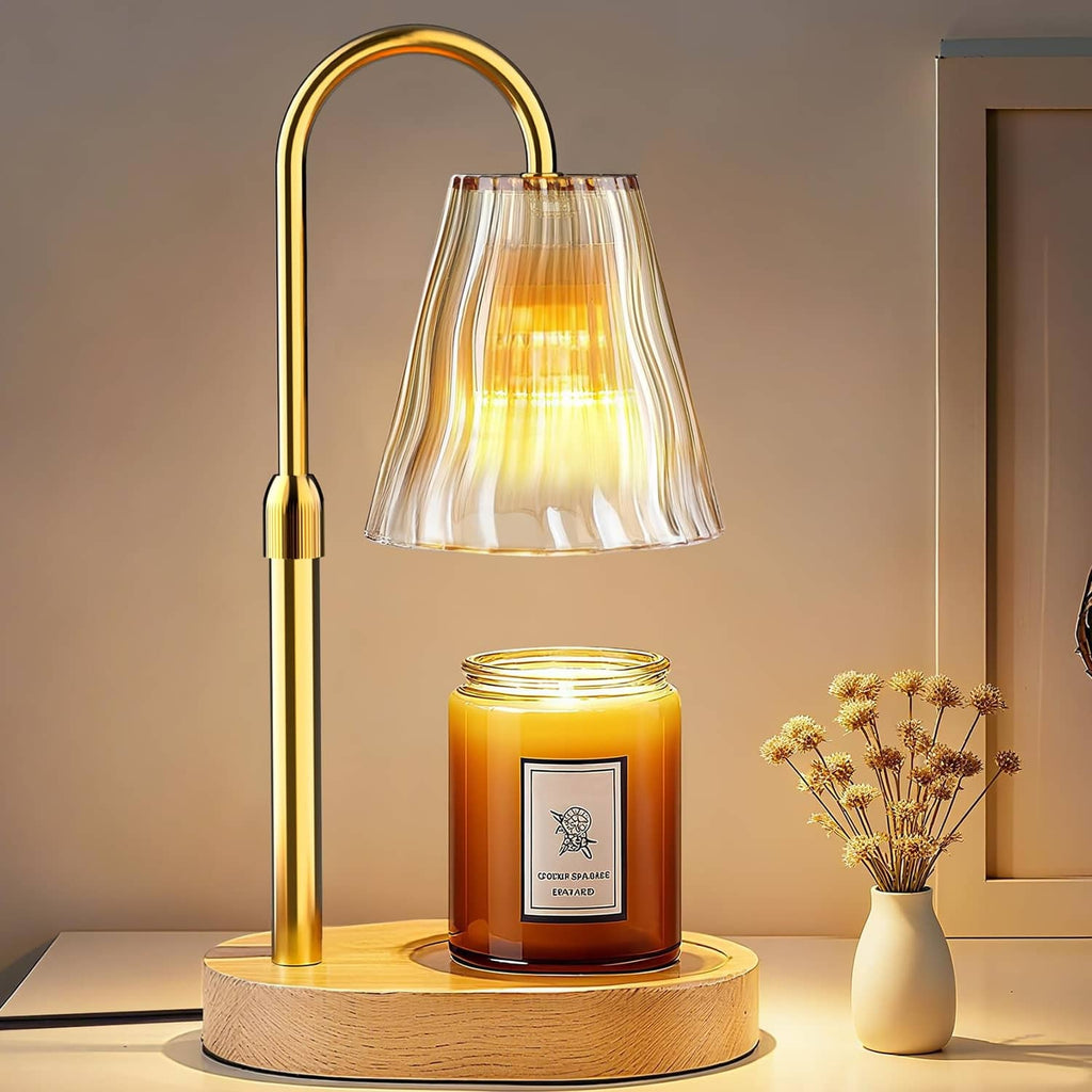 Luxmore candle warmer lamp with amber-gold arched metal frame, fluted glass shade, on wood base