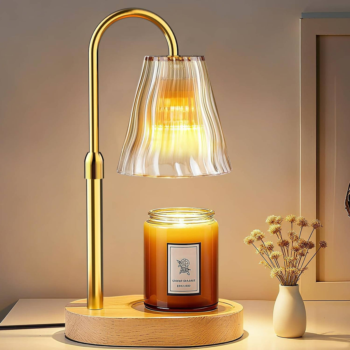 Luxmore candle warmer lamp with amber-gold arched metal frame, fluted glass shade, on wood base